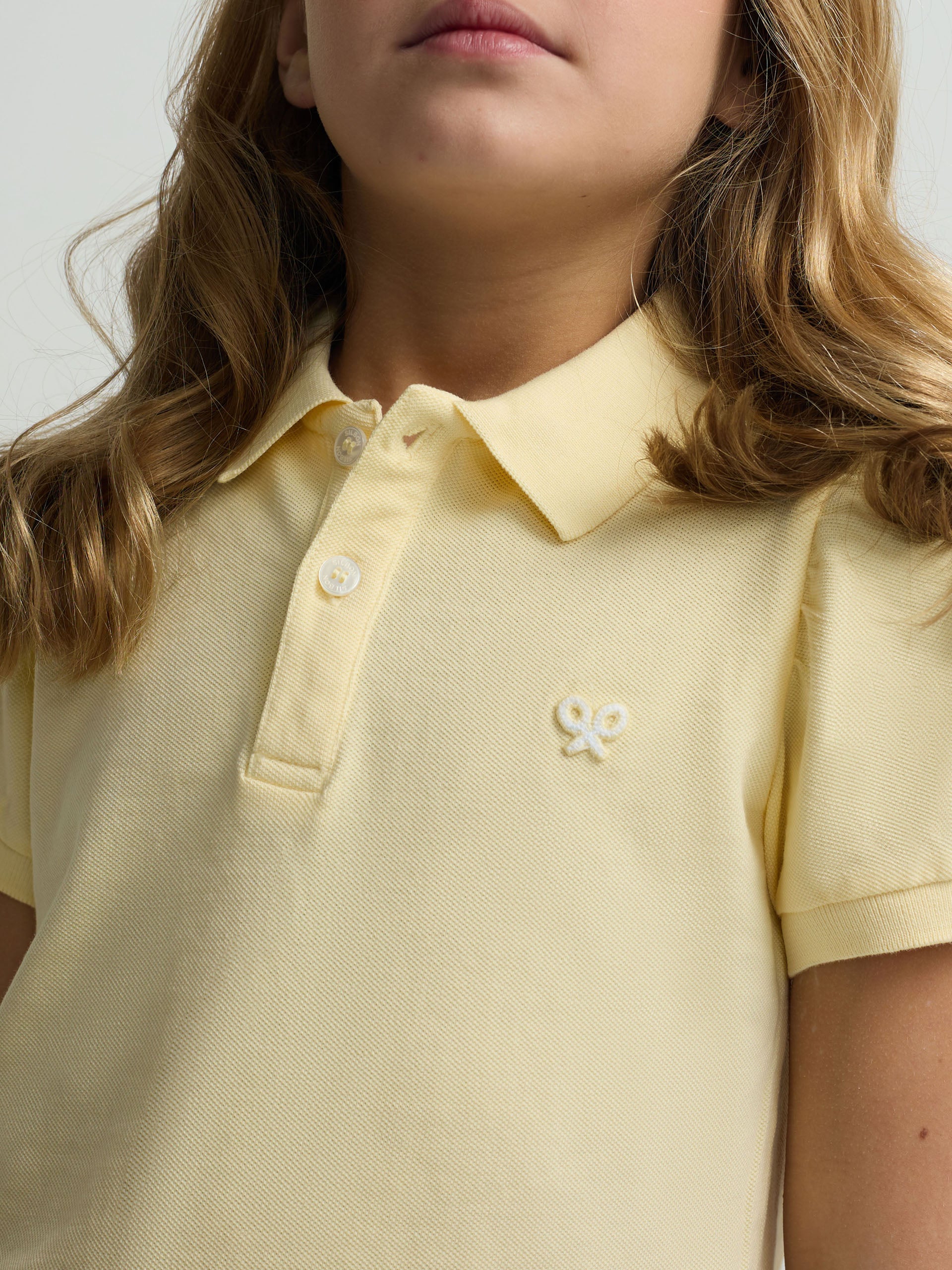 Polo girl manga abullonada amarillo