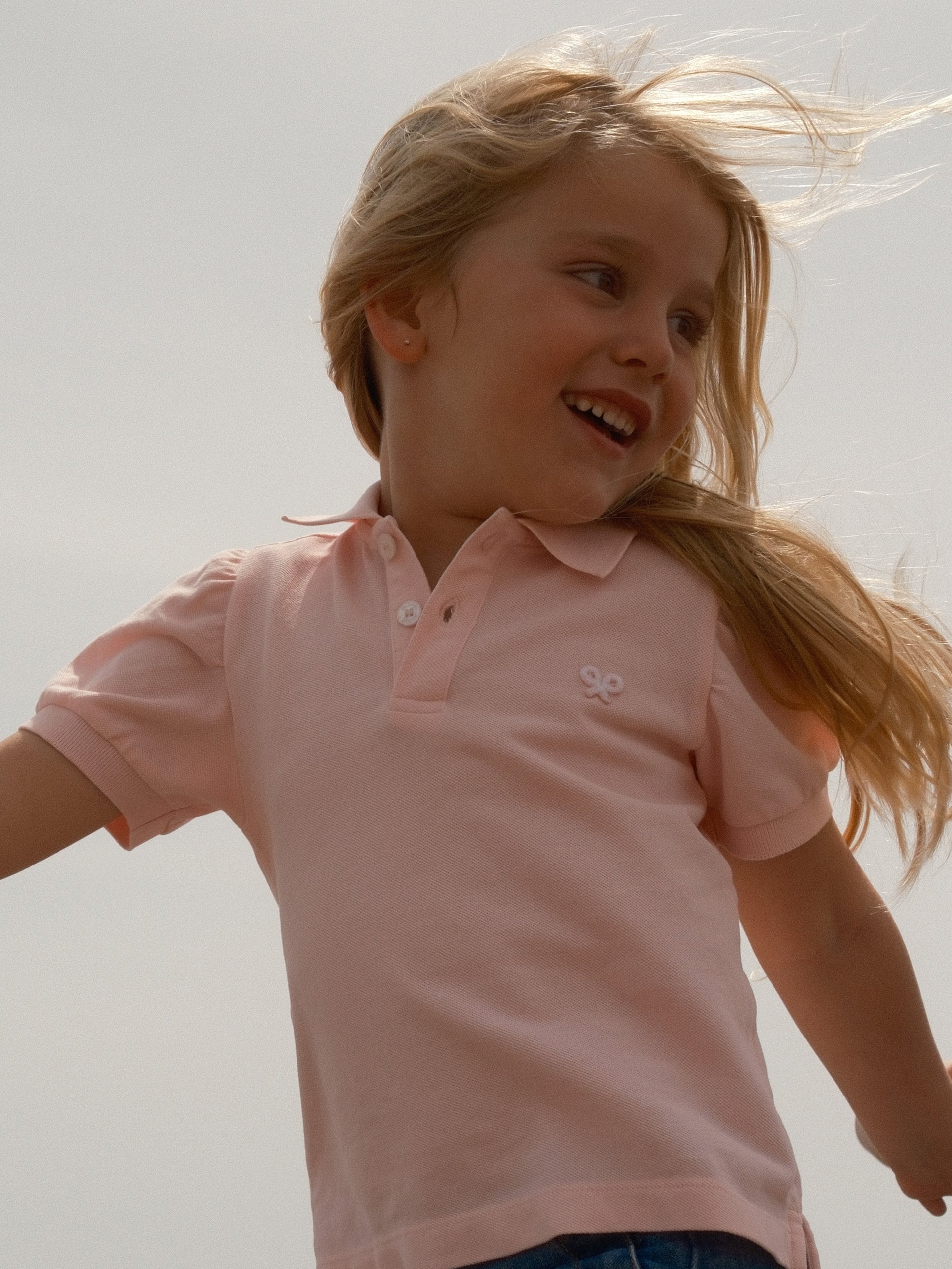Polo de menina com manga bufante rosa claro