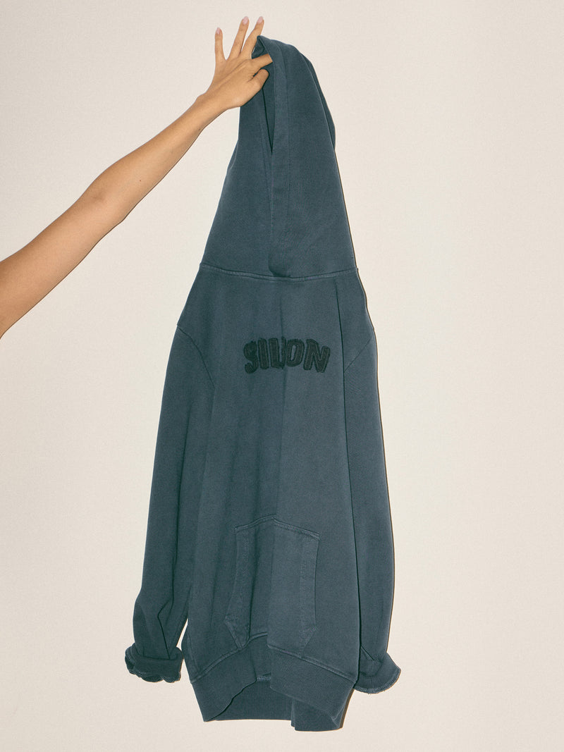 Sweat à capuche avec écusson bleu