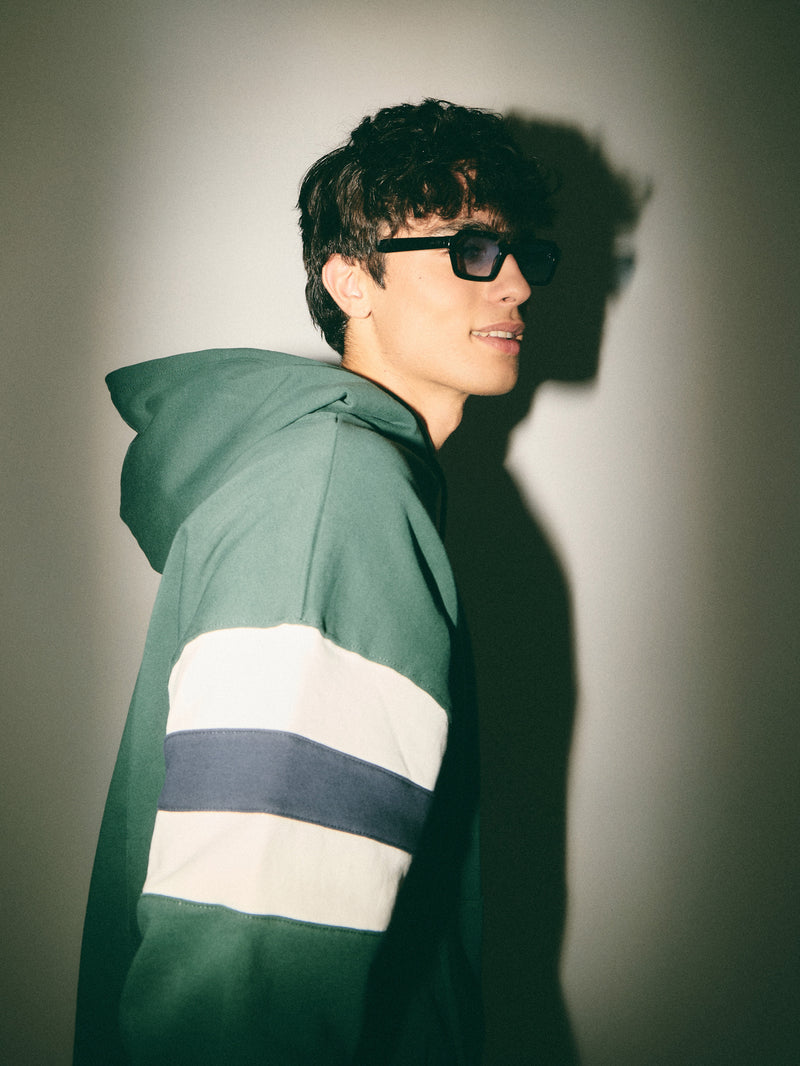 Sudadera capucha relaxed franjas verde oscuro