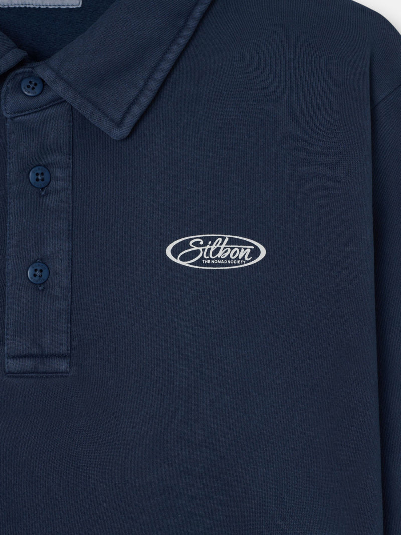 Worn navy blue polo neck sweatshirt