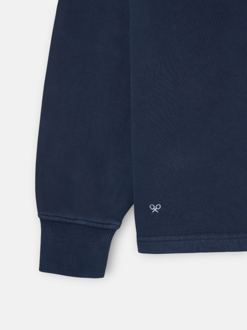 Worn navy blue polo neck sweatshirt