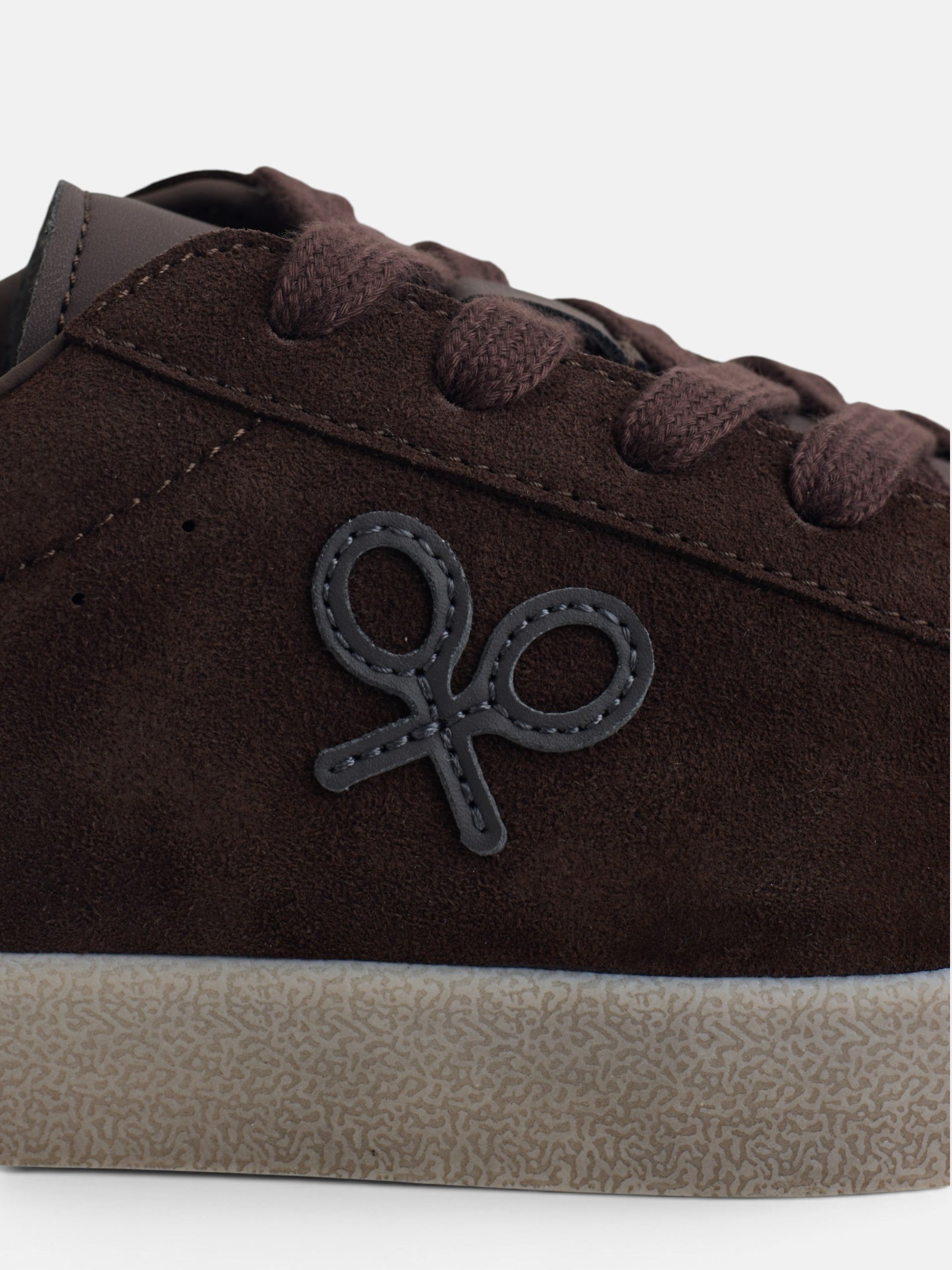 Worn brown suede sneaker
