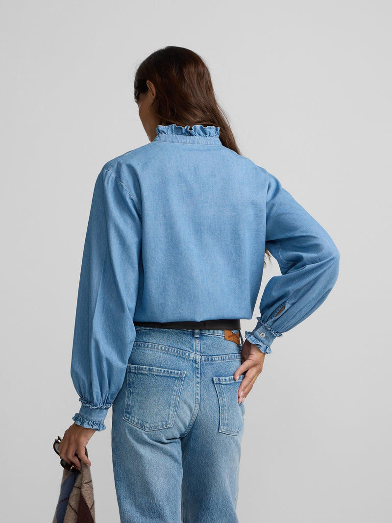 Denim shirt with ruffle collar and cuff detail