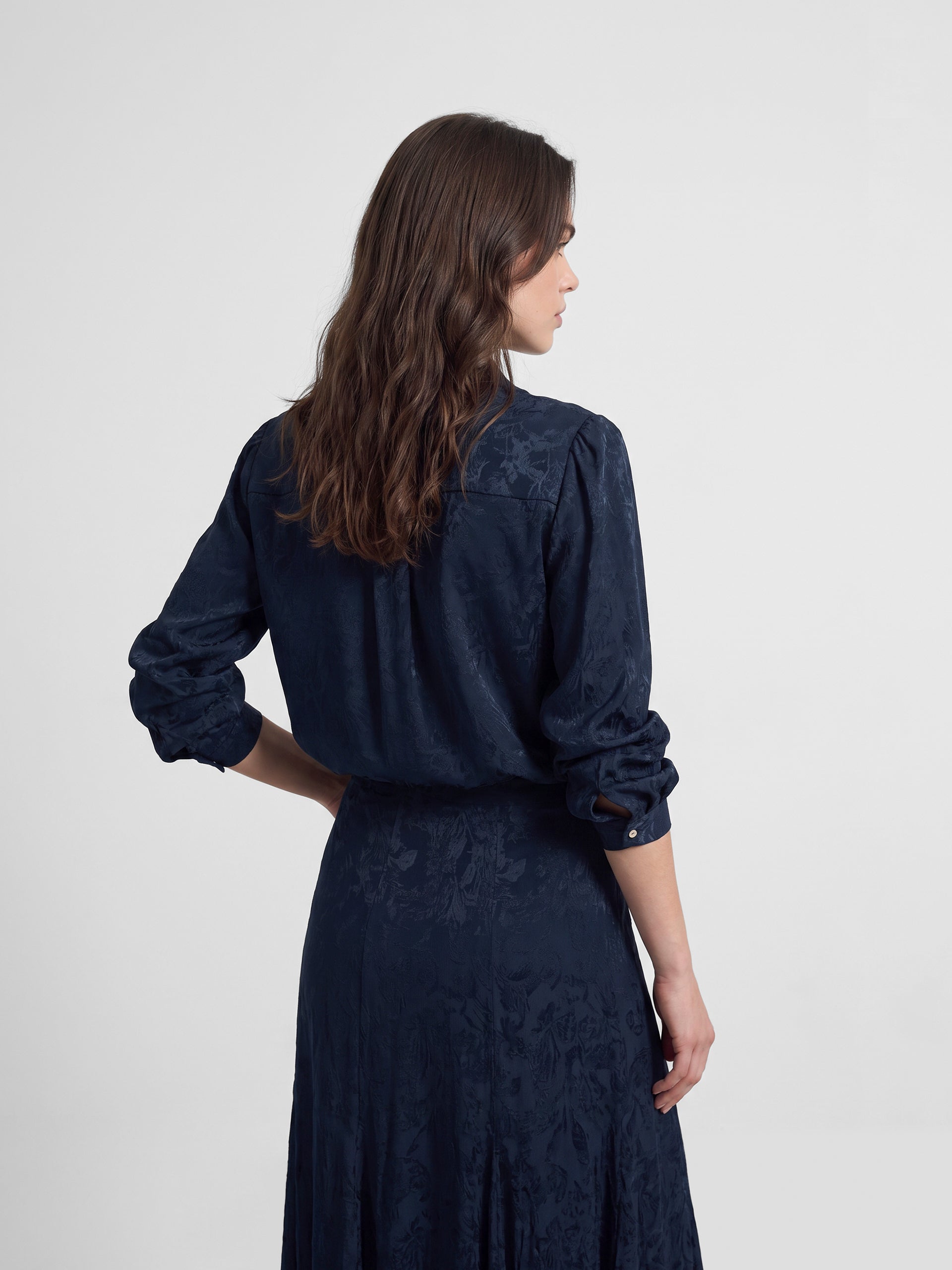 Blue jacquard neck strap blouse