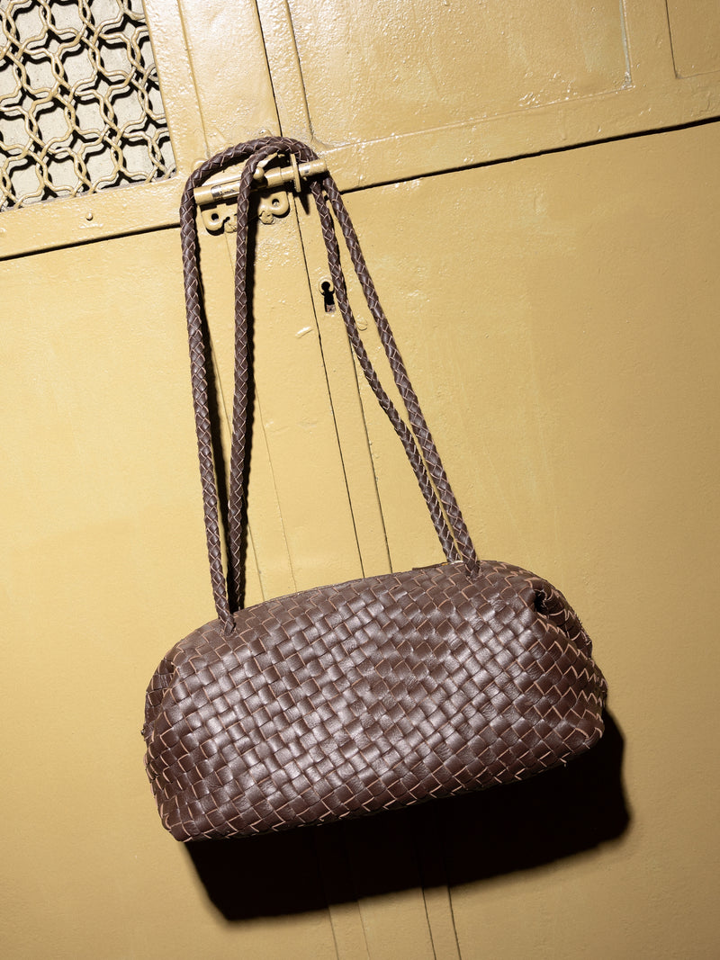 Elongated braided brown leather shoulder bag