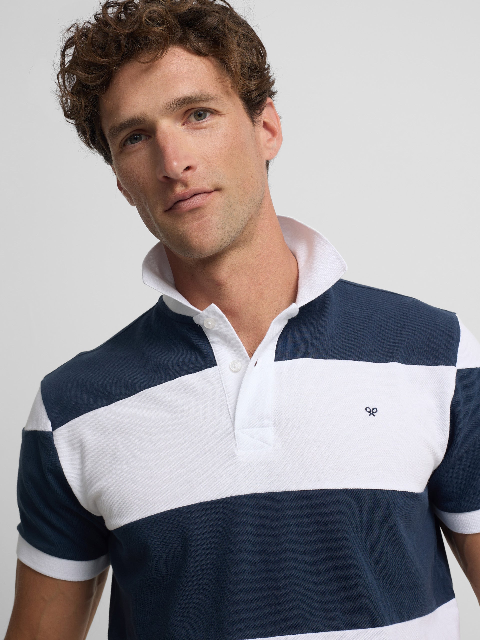 Polo manga corta rayas anchas azul marino