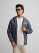 Sudadera cremallera bordado azul indigo