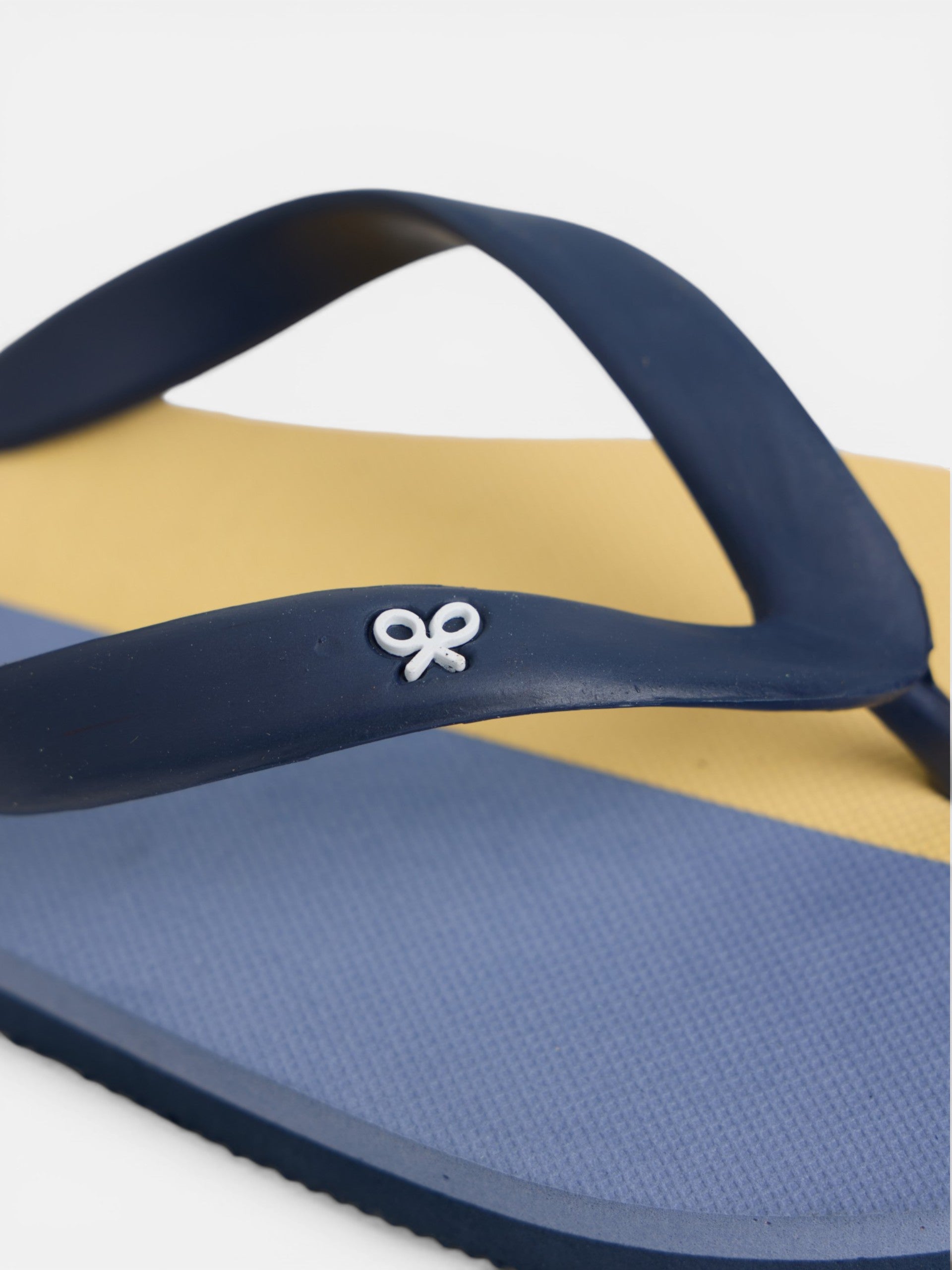 Two-tone yellow paddle flip-flops