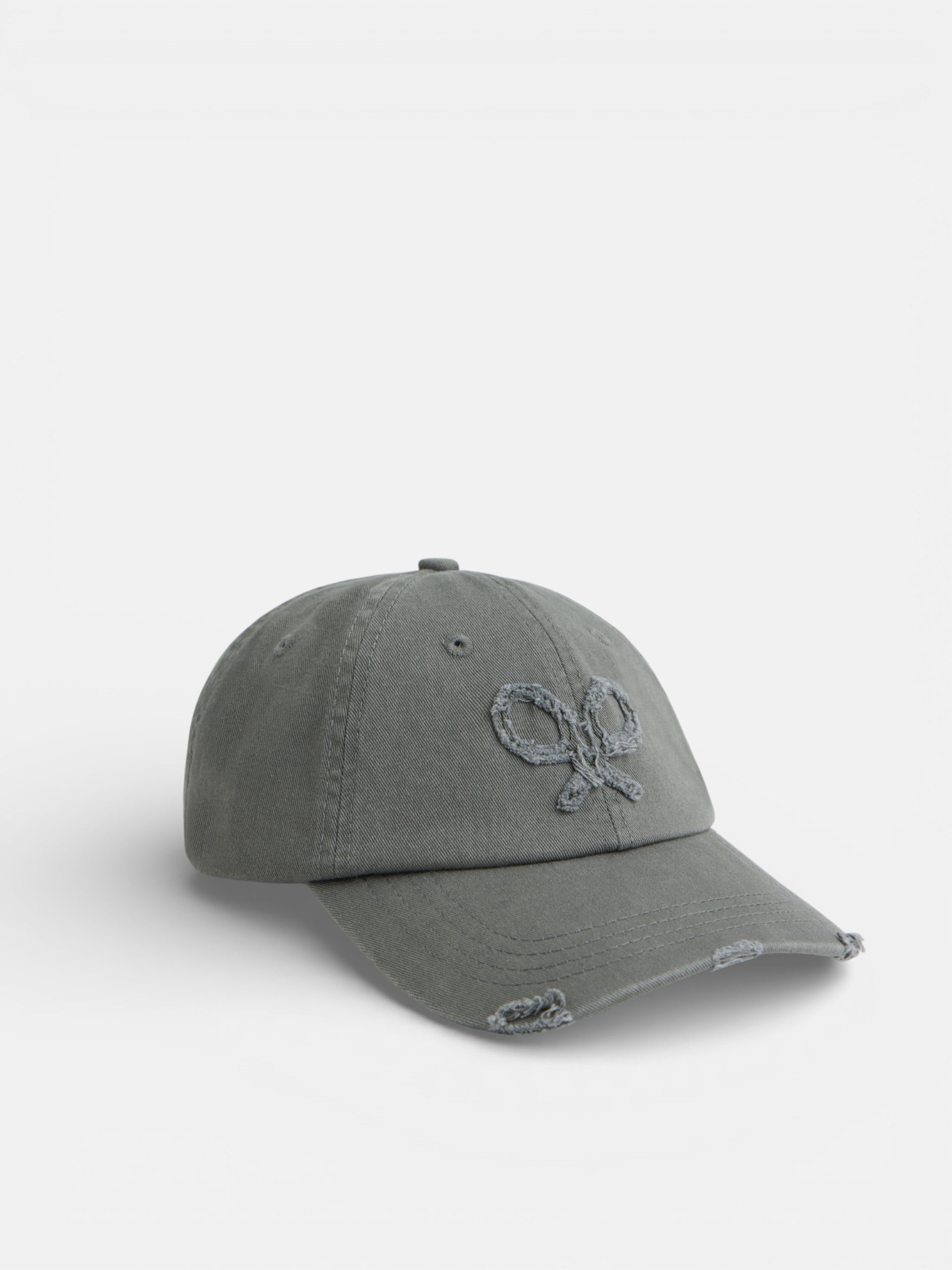 Casquette verte à motif raquette en relief