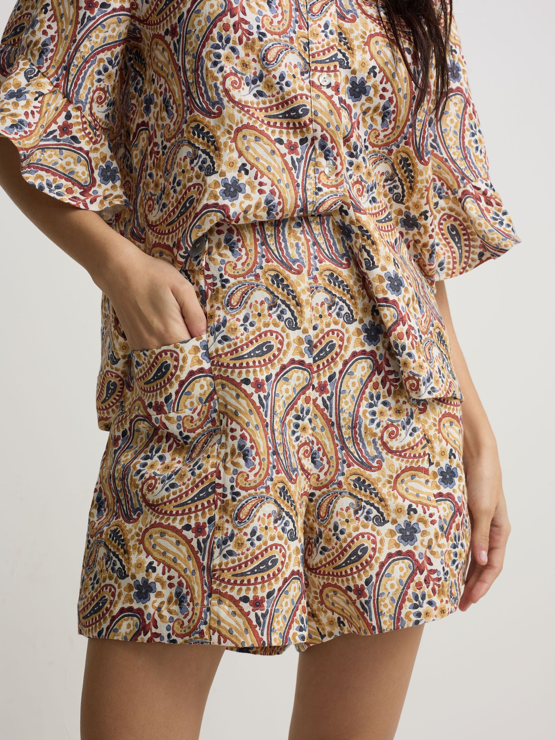 Orange paisley print linen Bermuda shorts