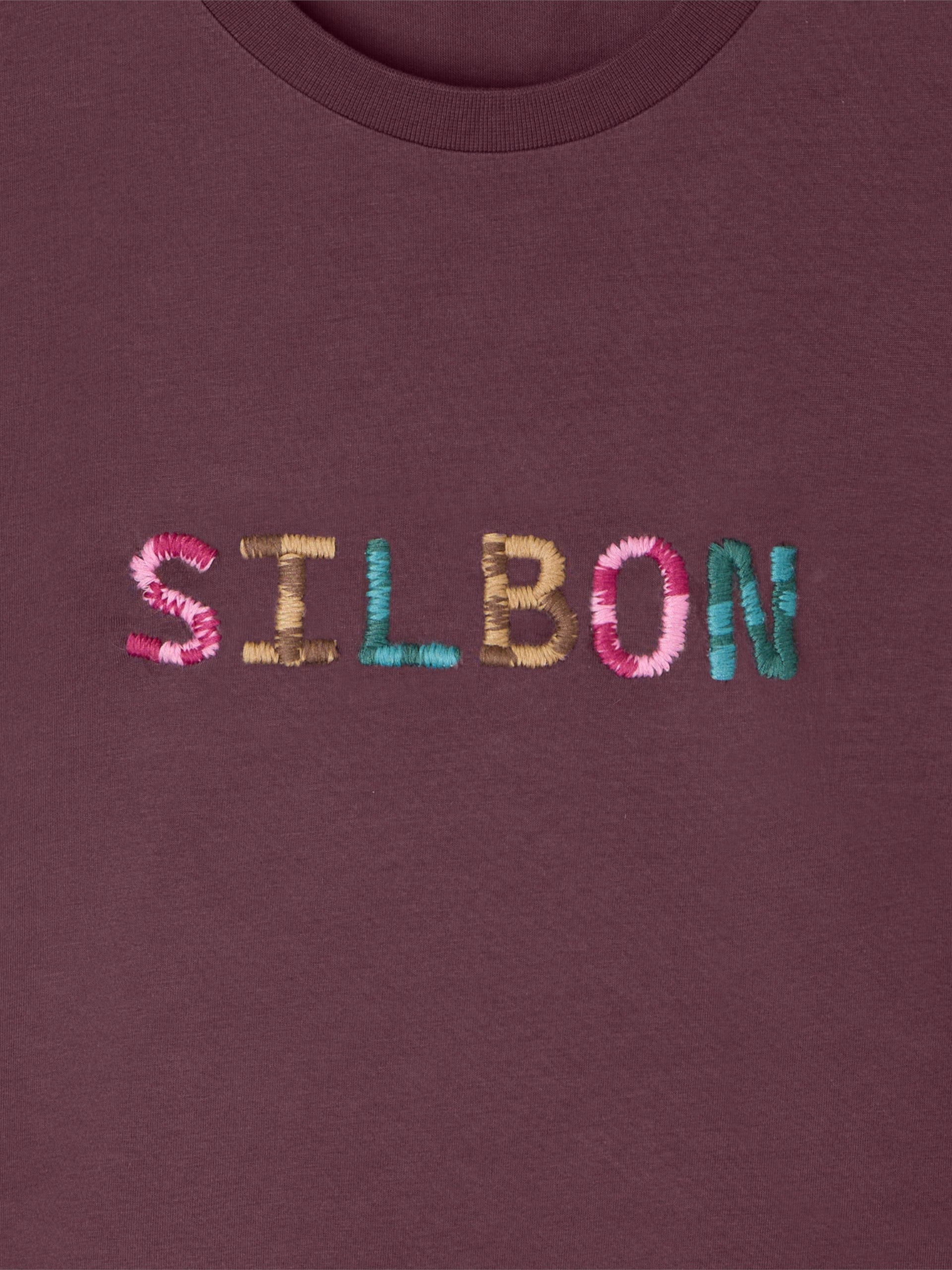 Camiseta mulher silbon rabiscada roxa