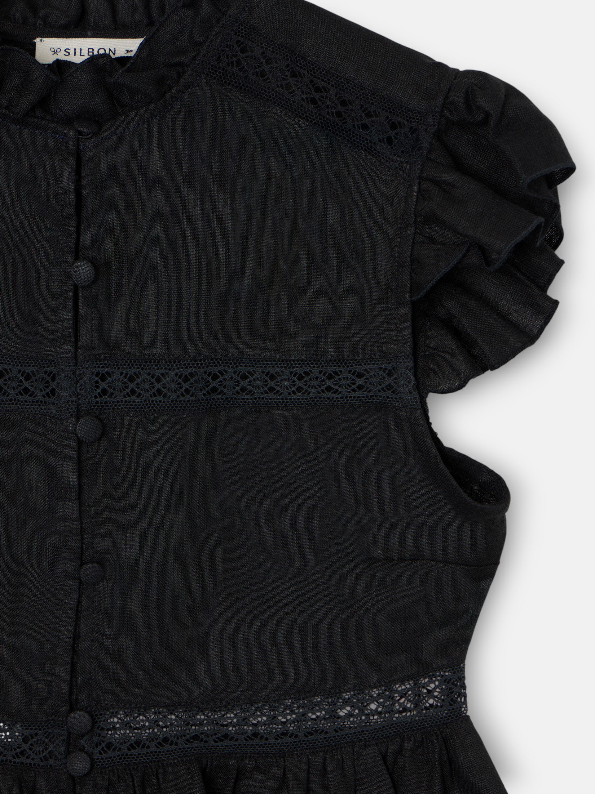 Blouse noire à détails brodés