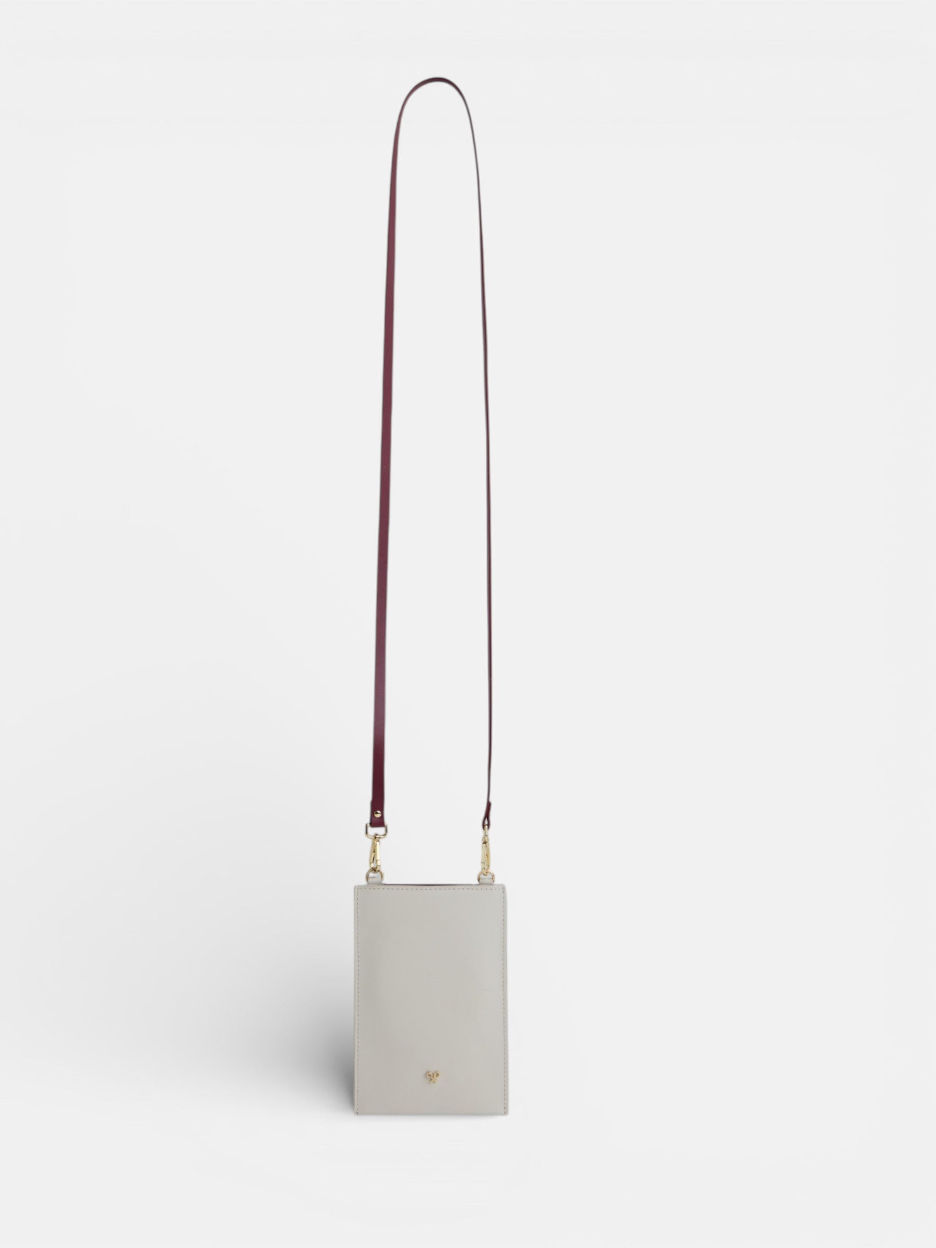 Porte-téléphone en cuir écru et bordeaux