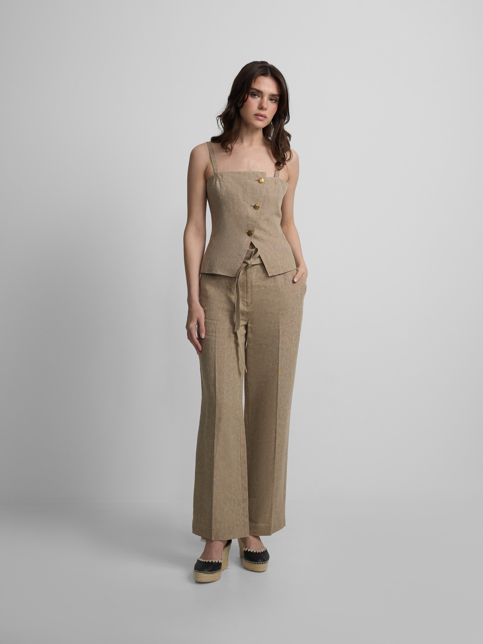 Straight beige trousers with slits