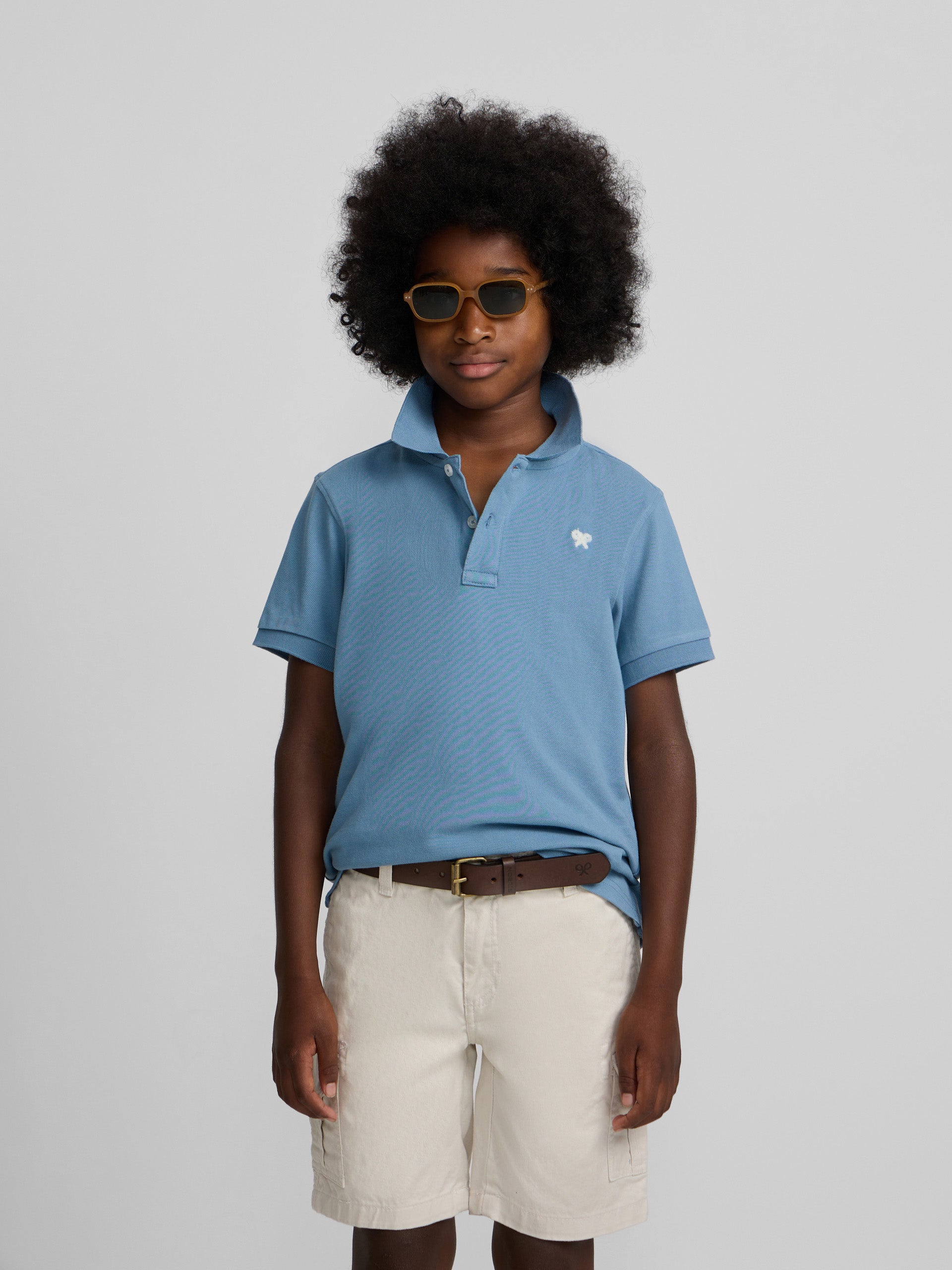 Polo enfant uni logo bouclé bleu moyen