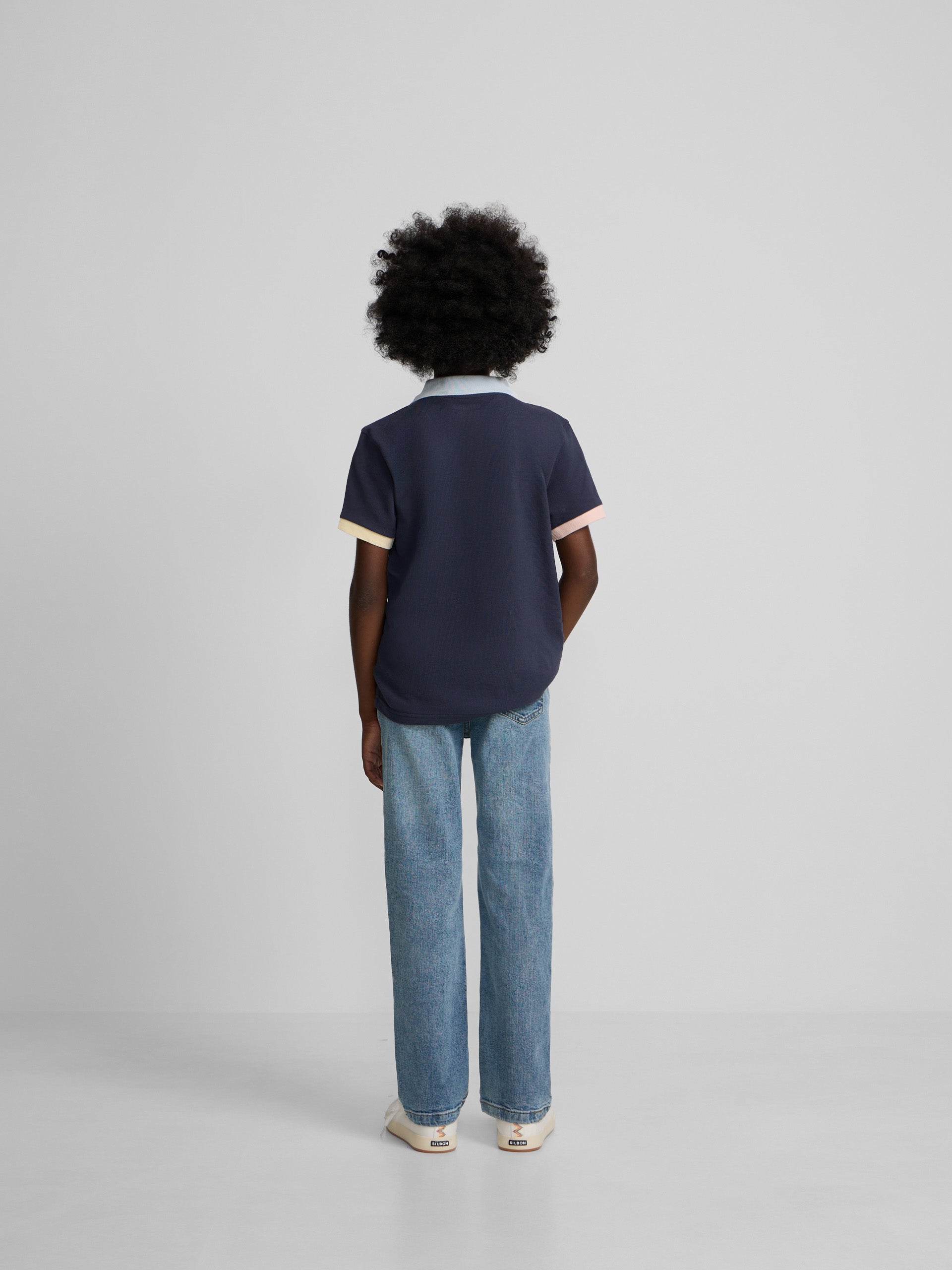 Polo enfant à liseré multicolore bleu marine