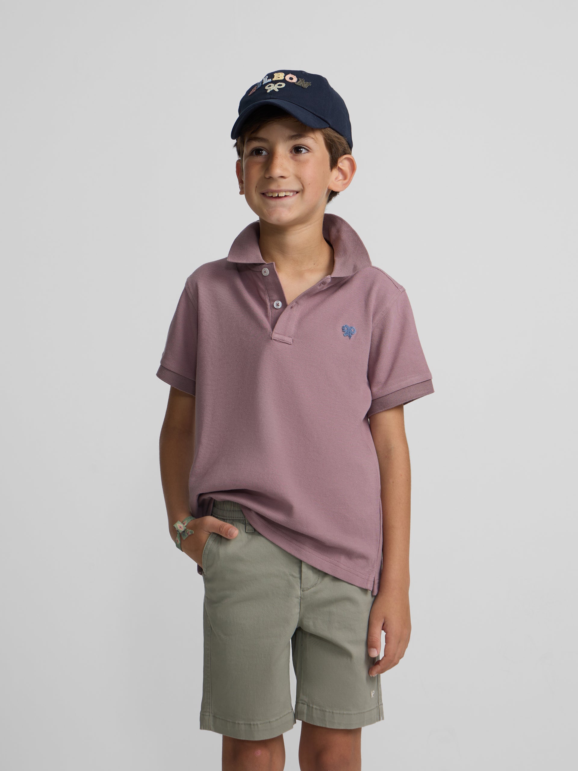 Polo enfant uni logo bouclé bordeaux