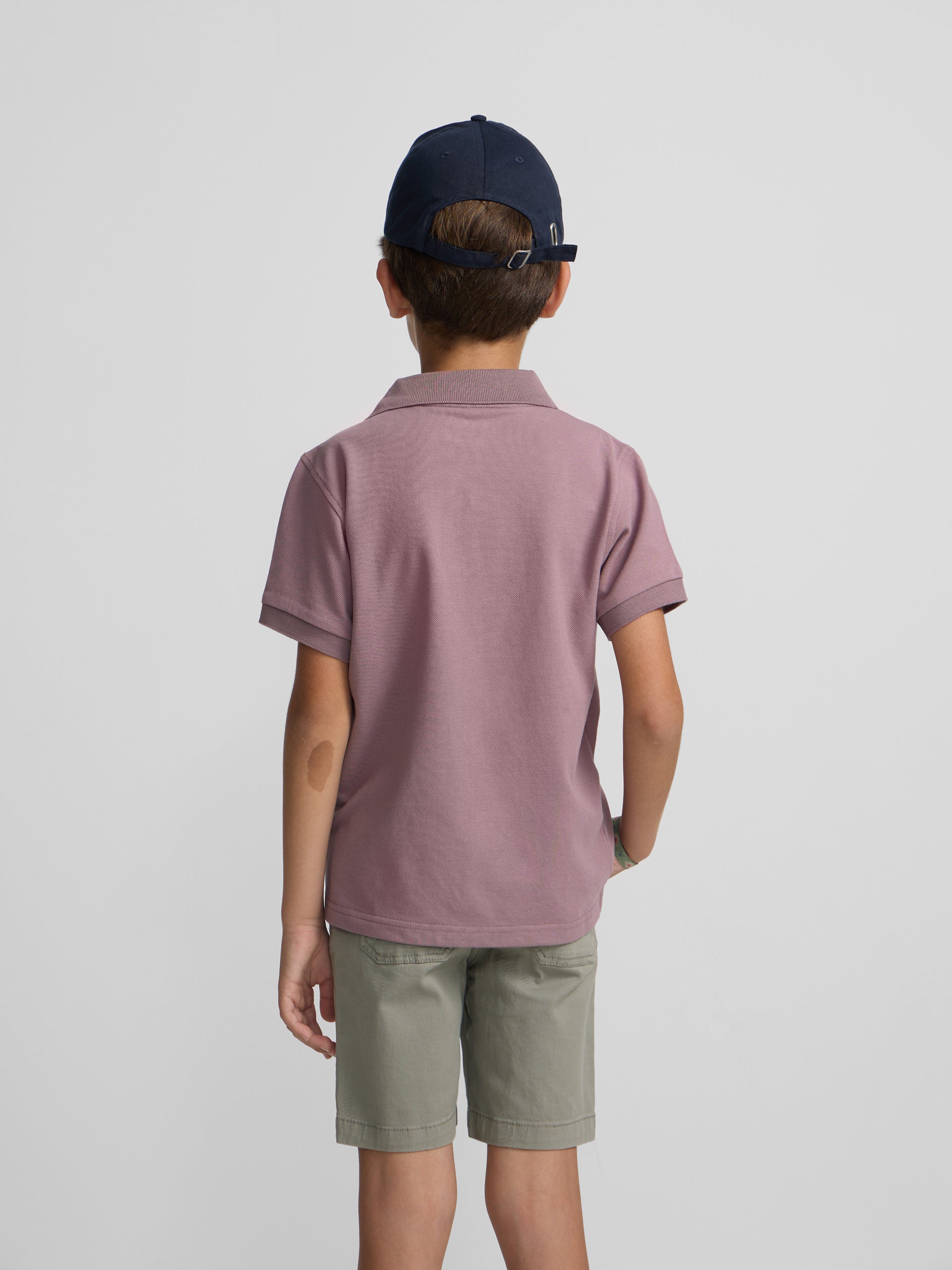Polo enfant uni logo bouclé bordeaux