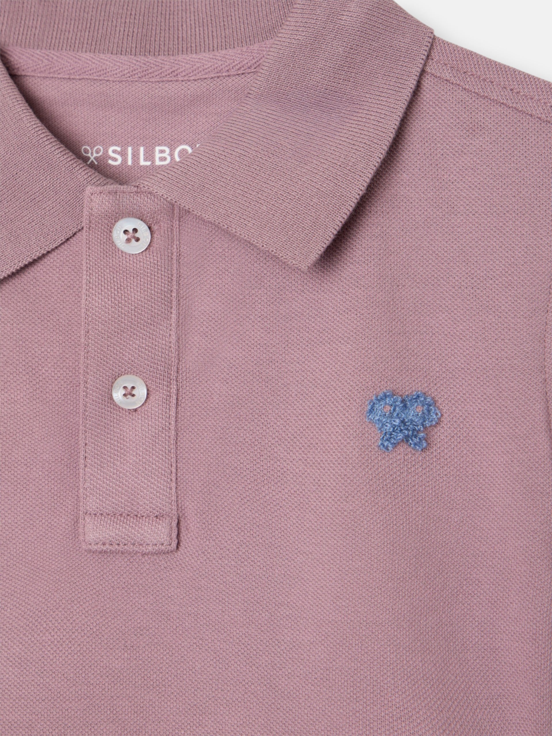 Polo enfant uni logo bouclé bordeaux