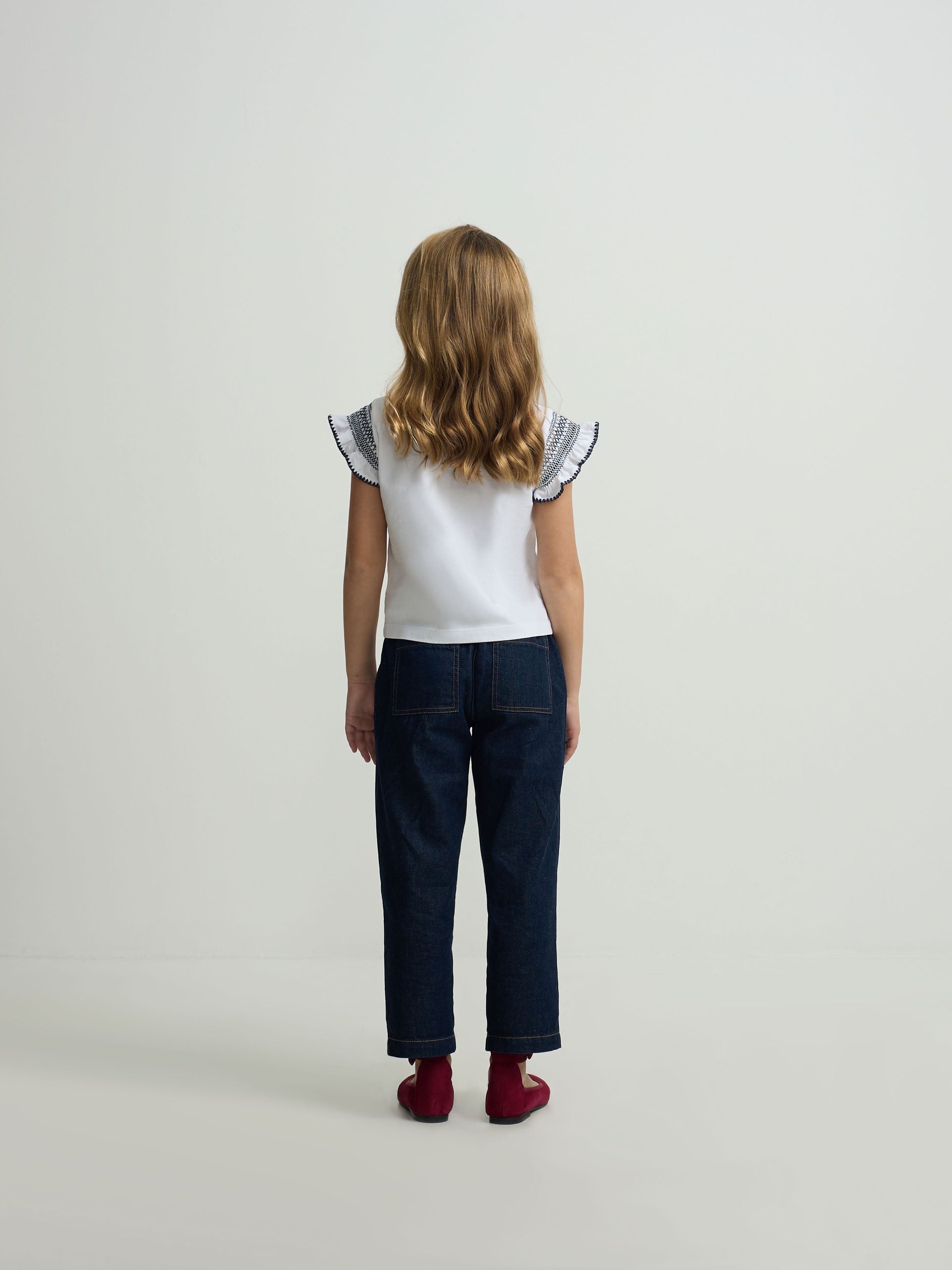 White girl’s t-shirt with embroidered sleeves