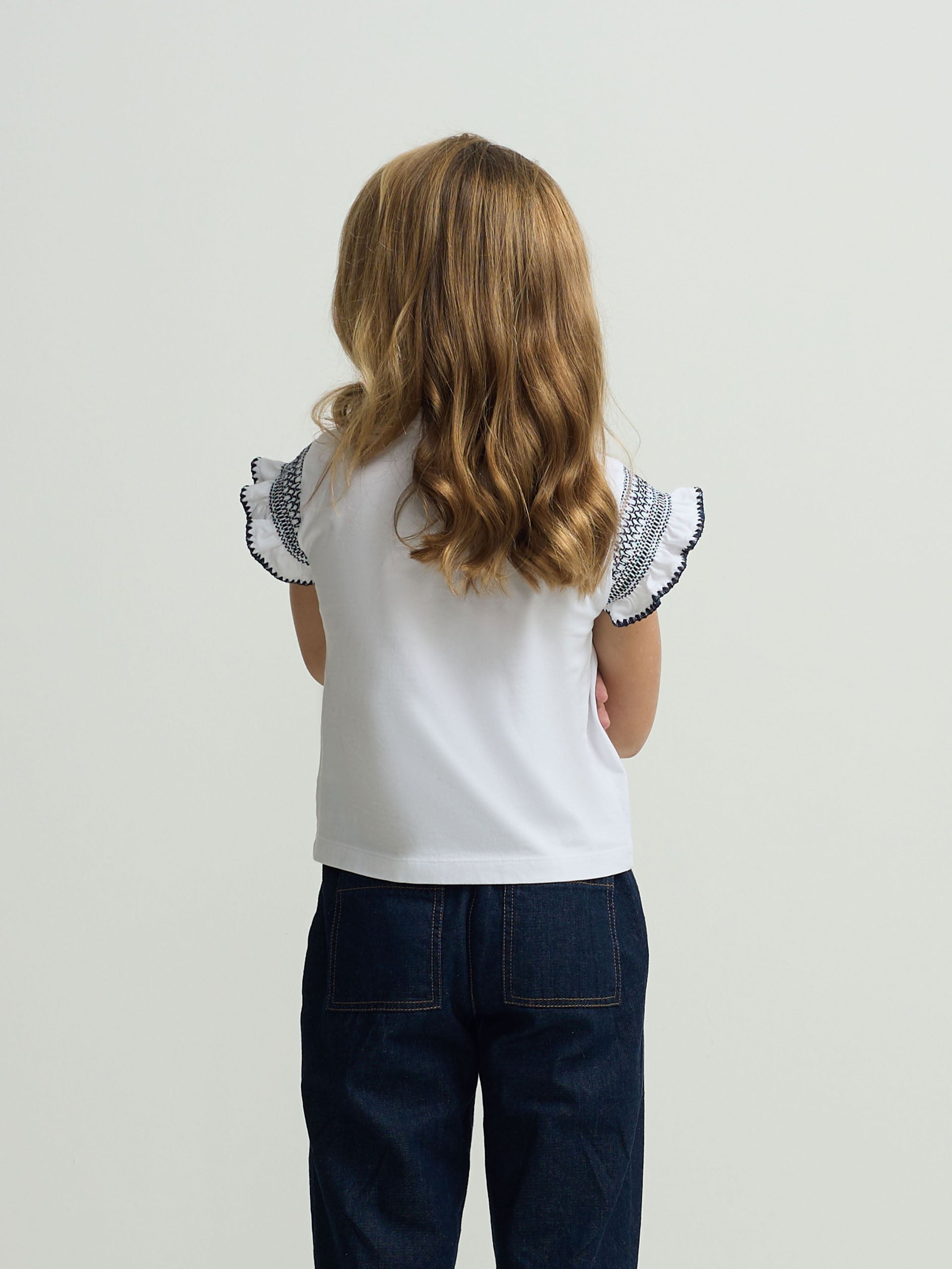 White girl’s t-shirt with embroidered sleeves