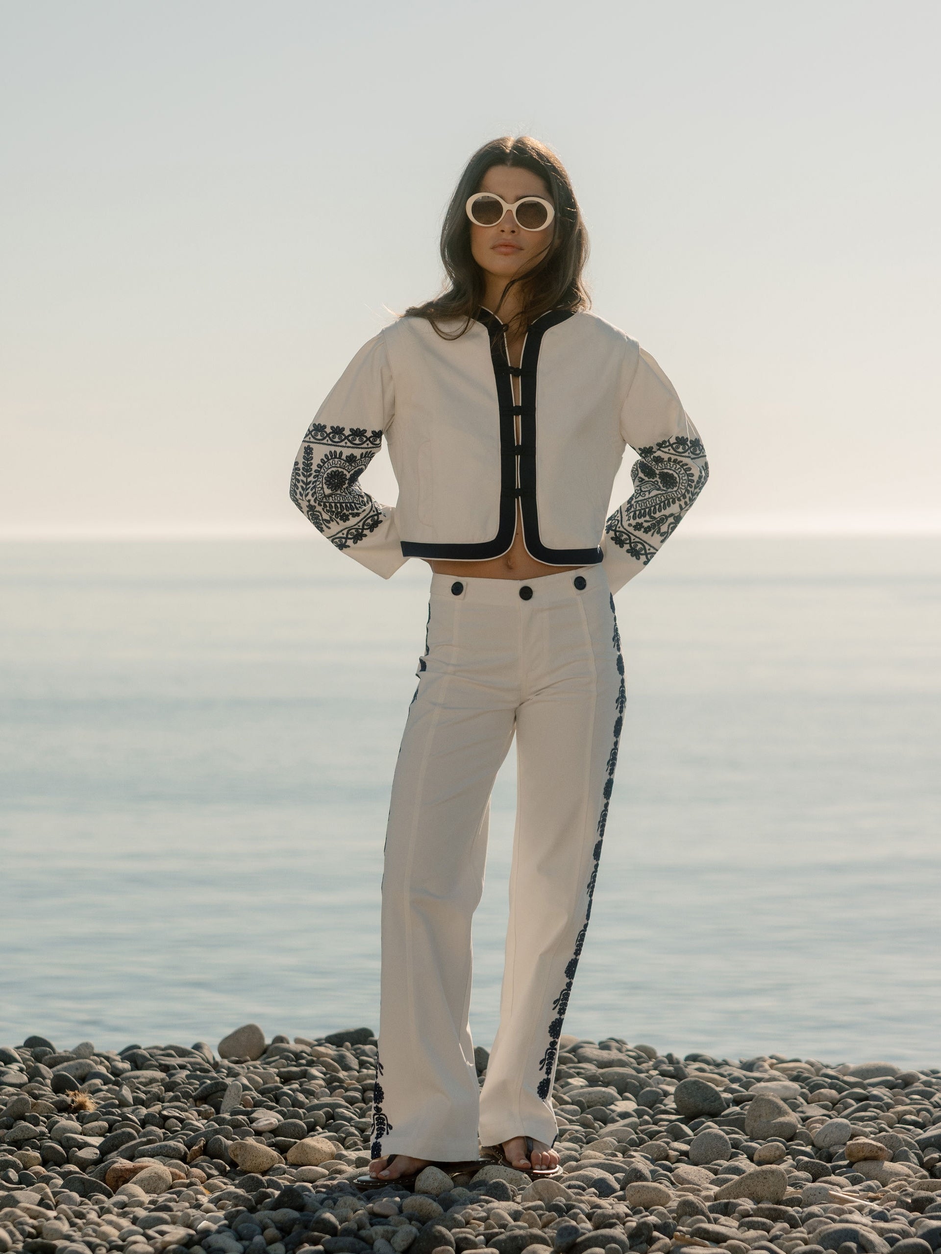 Straight pants with embroidered details in white