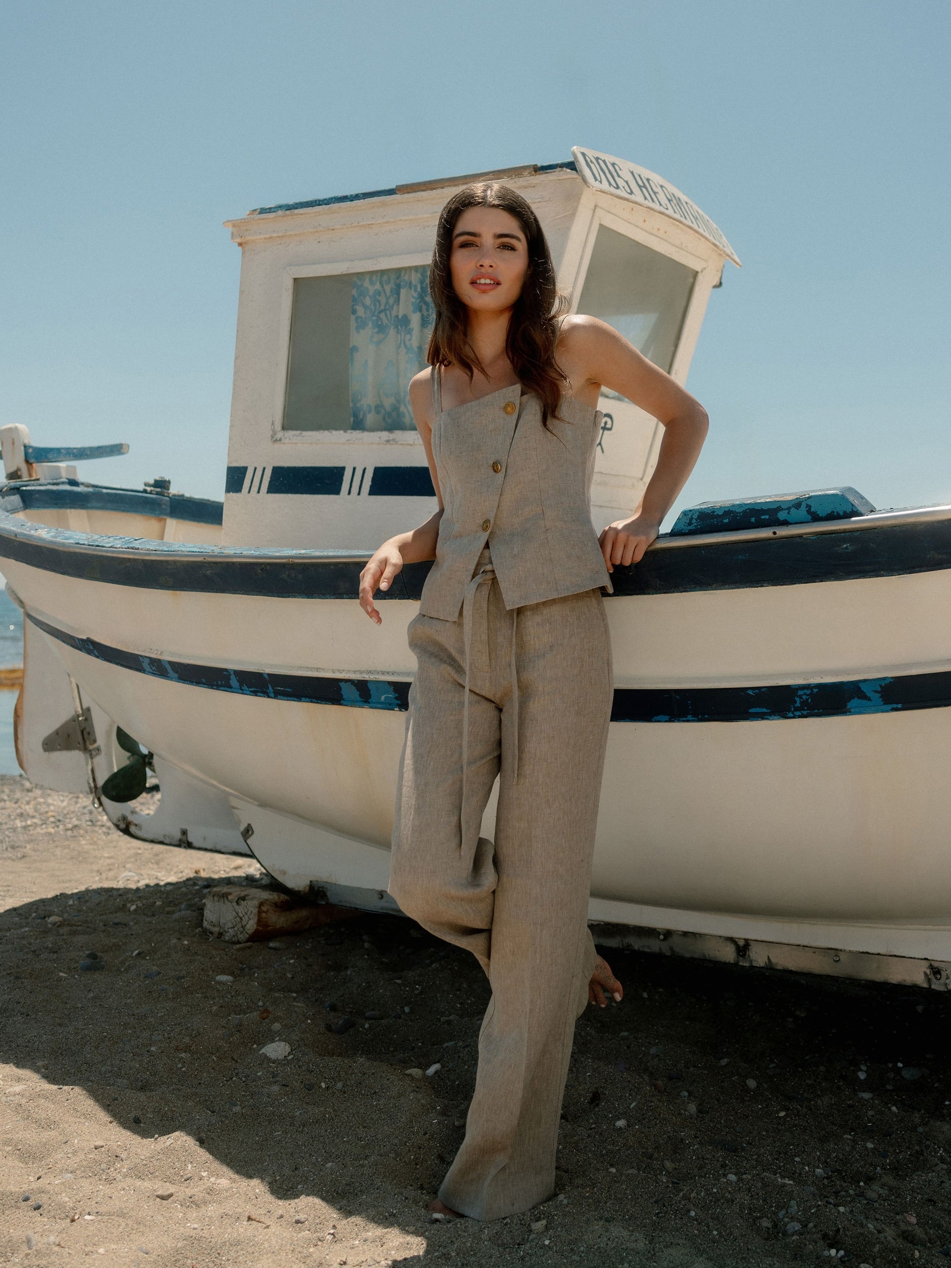 Straight beige trousers with slits