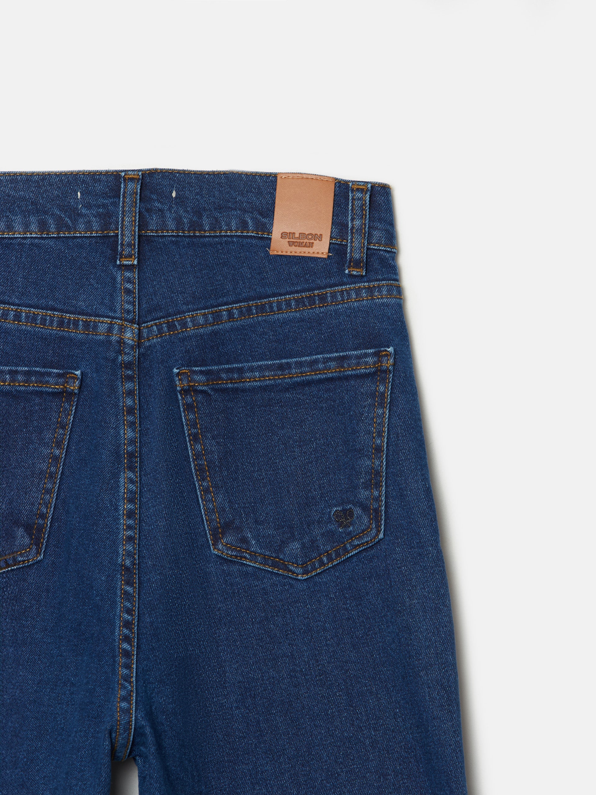 Flared denim trousers with pockets