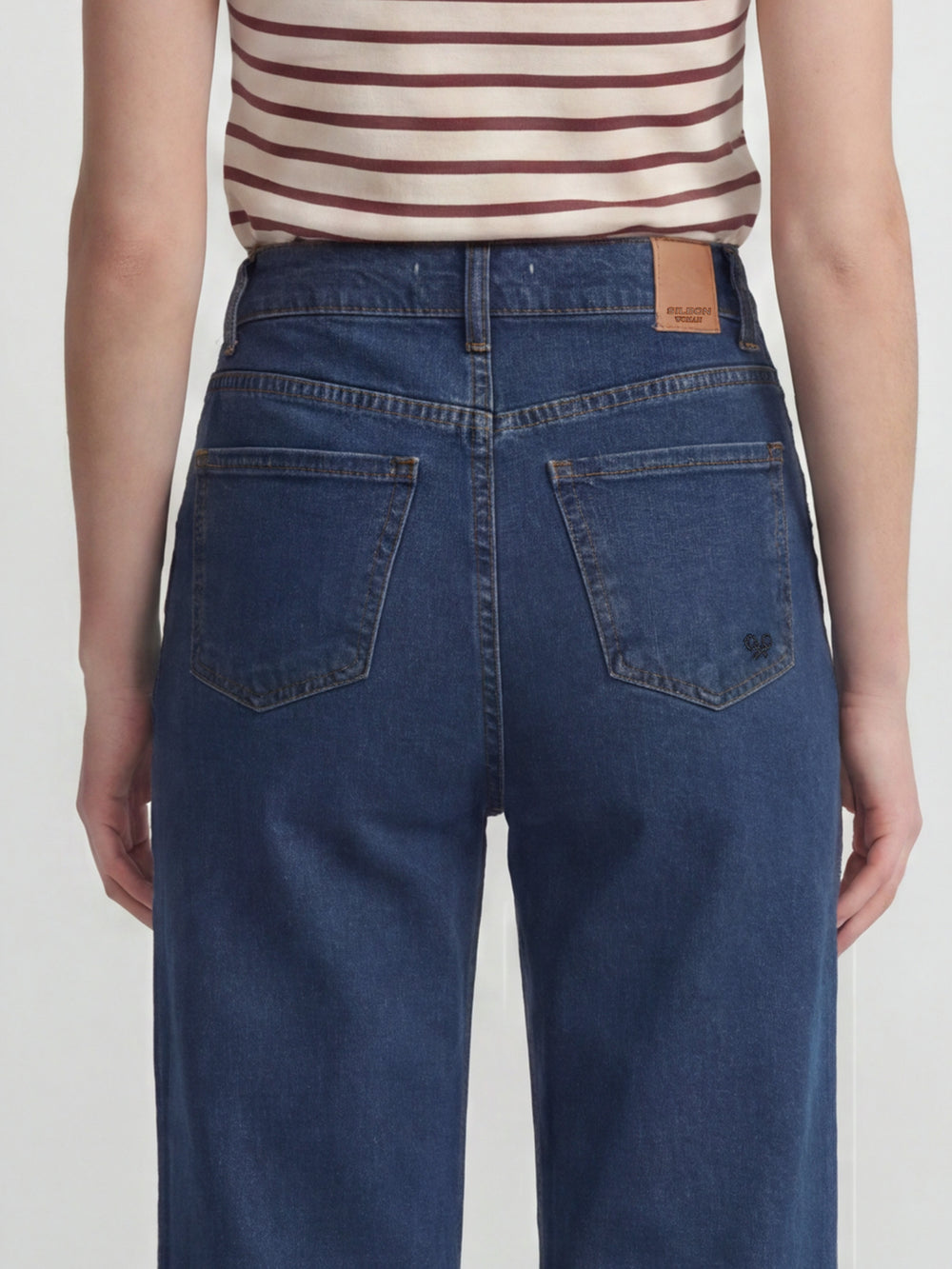 Flared denim trousers with pockets