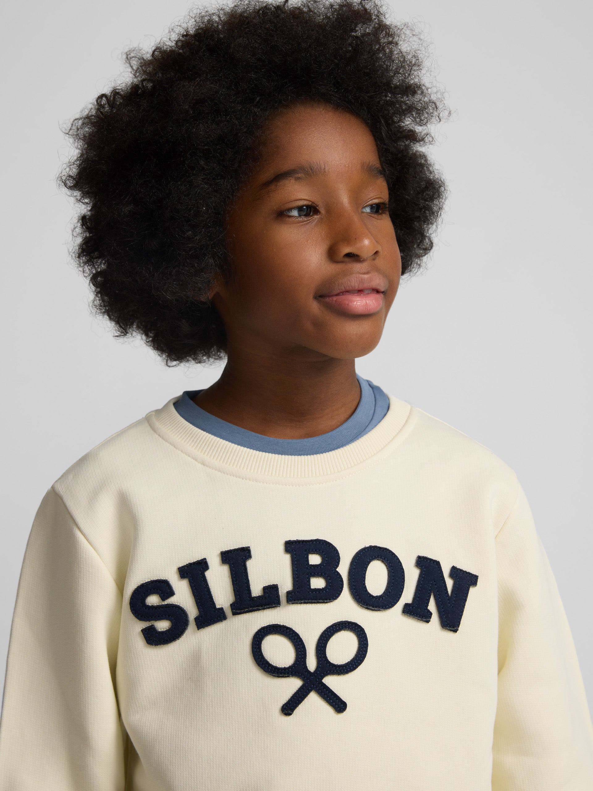 Sudadera kids raqueta media crema