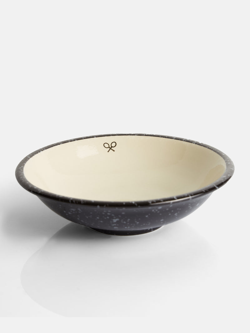 Assiette creuse en céramique émaillée bicolore