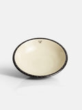 Assiette creuse en céramique émaillée bicolore