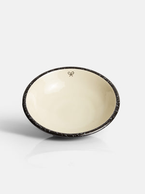 Assiette creuse en céramique émaillée bicolore