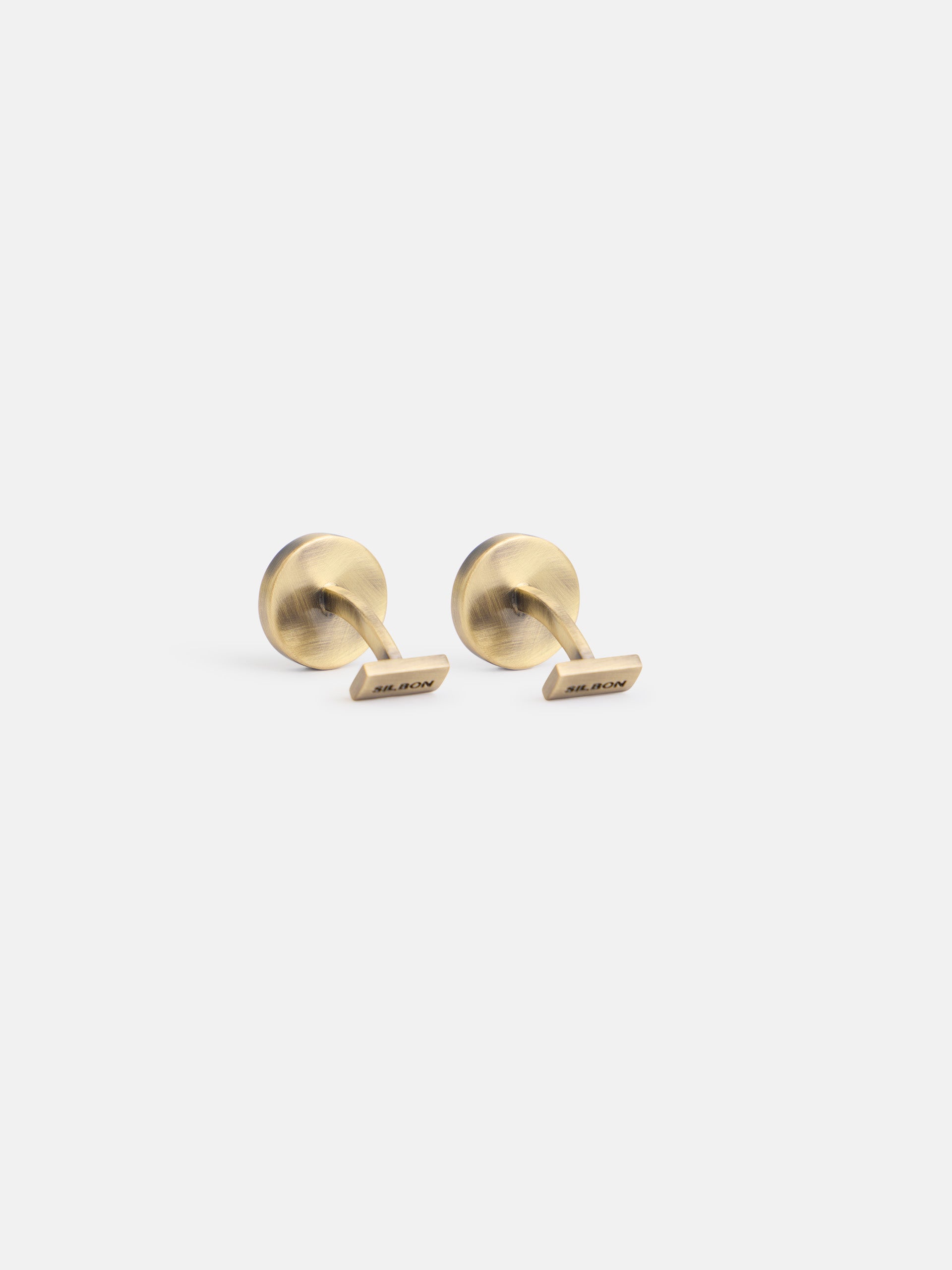 Round cufflink with racket coin