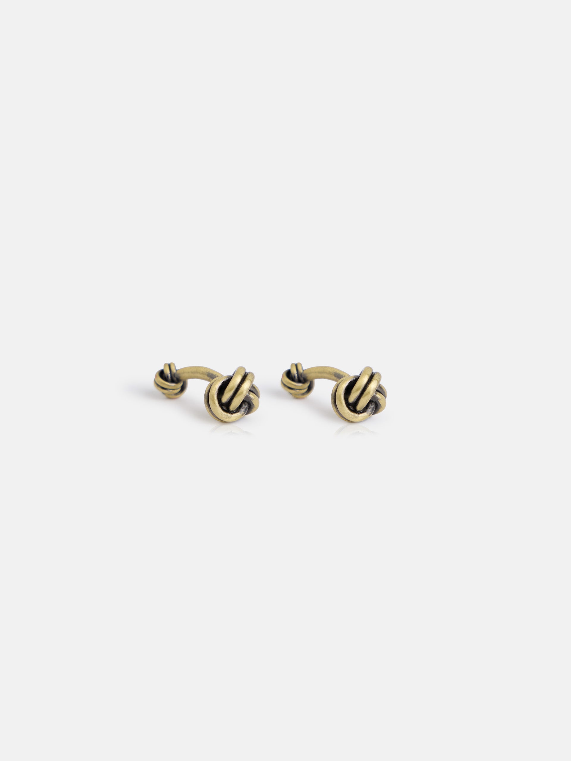 Aged gold knot cufflink