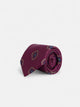 Burgundy tie with irregular geometric pattern