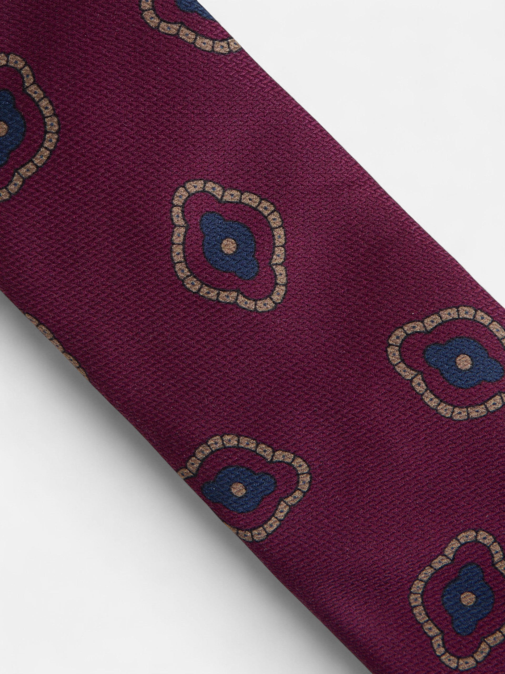 Burgundy tie with irregular geometric pattern