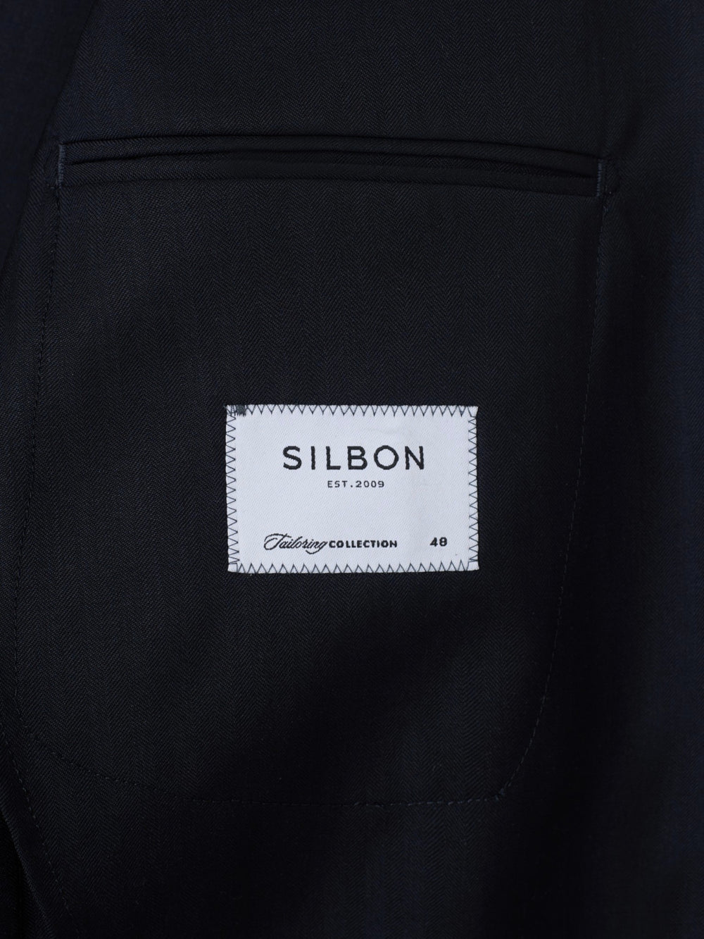 Navy blue herringbone suit jacket