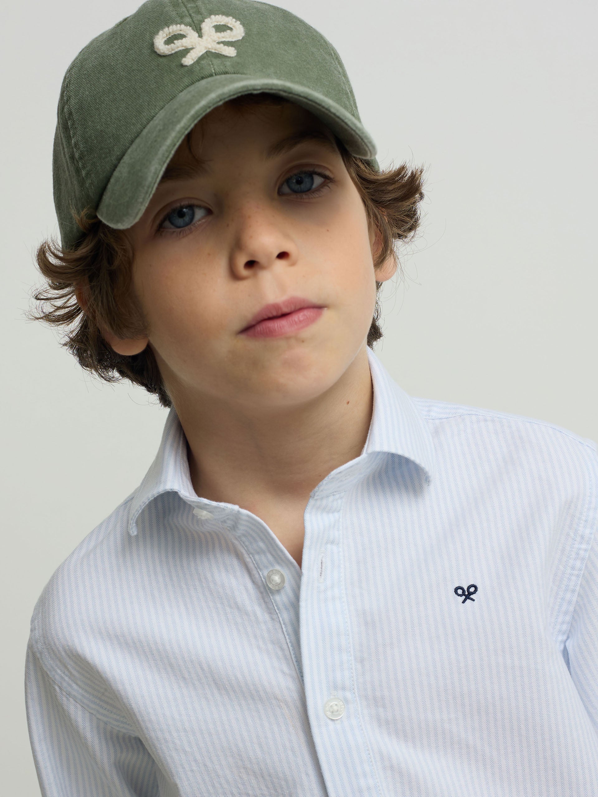 Kids' sport polo with blue vertical stripes