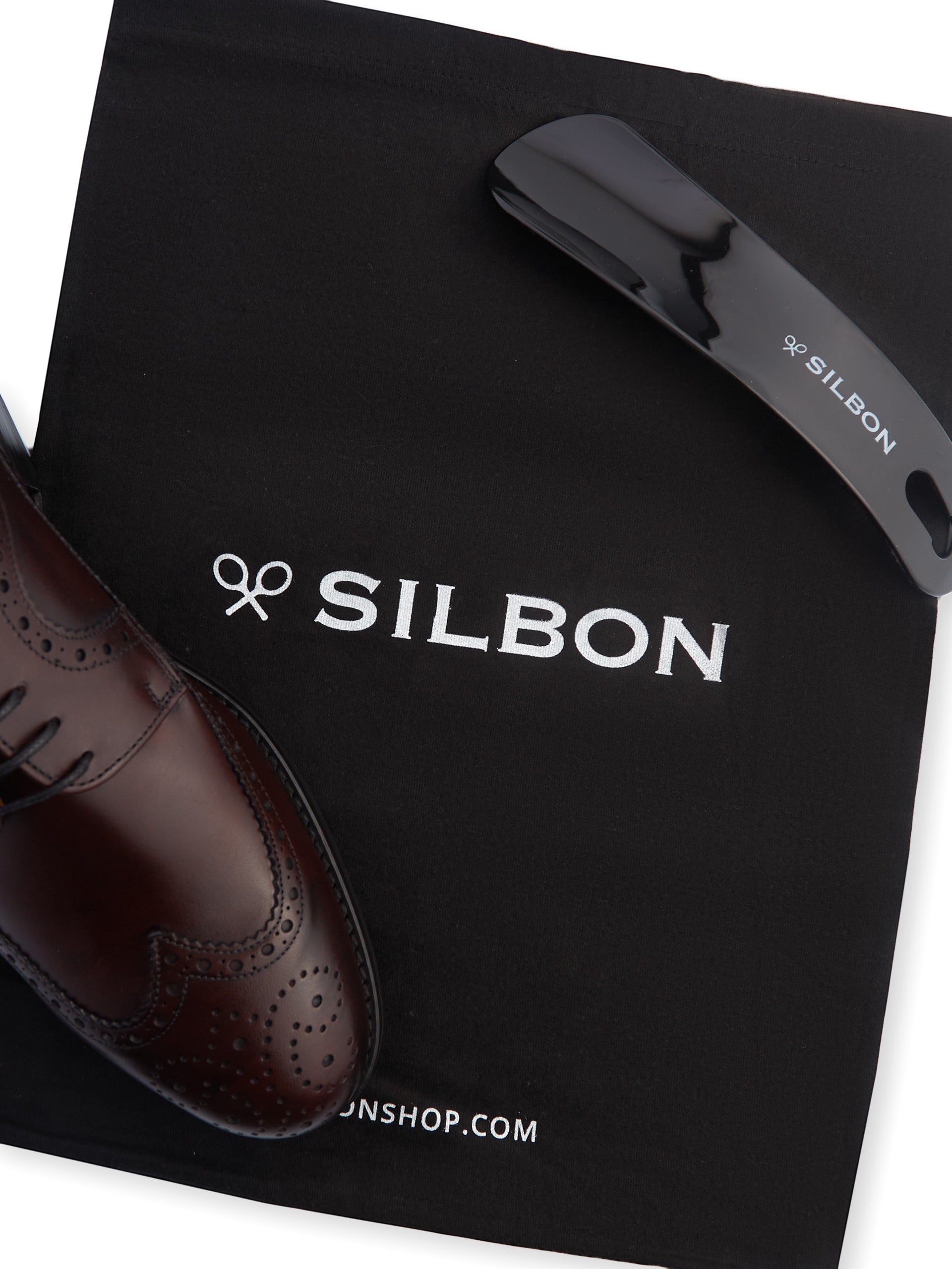 Zapato clasico piel perforado burdeos
