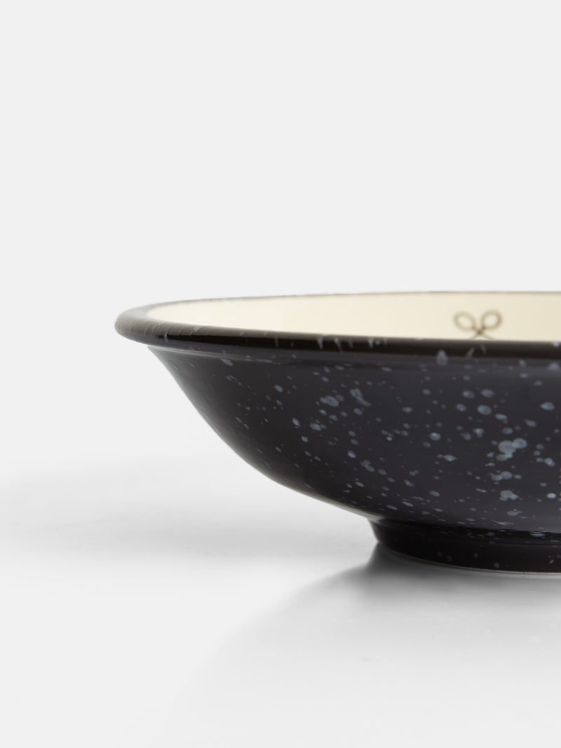 Assiette creuse en céramique émaillée bicolore