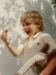 Polo kids liso logo rizo amarillo