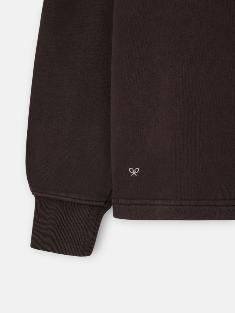 Worn brown polo neck sweatshirt