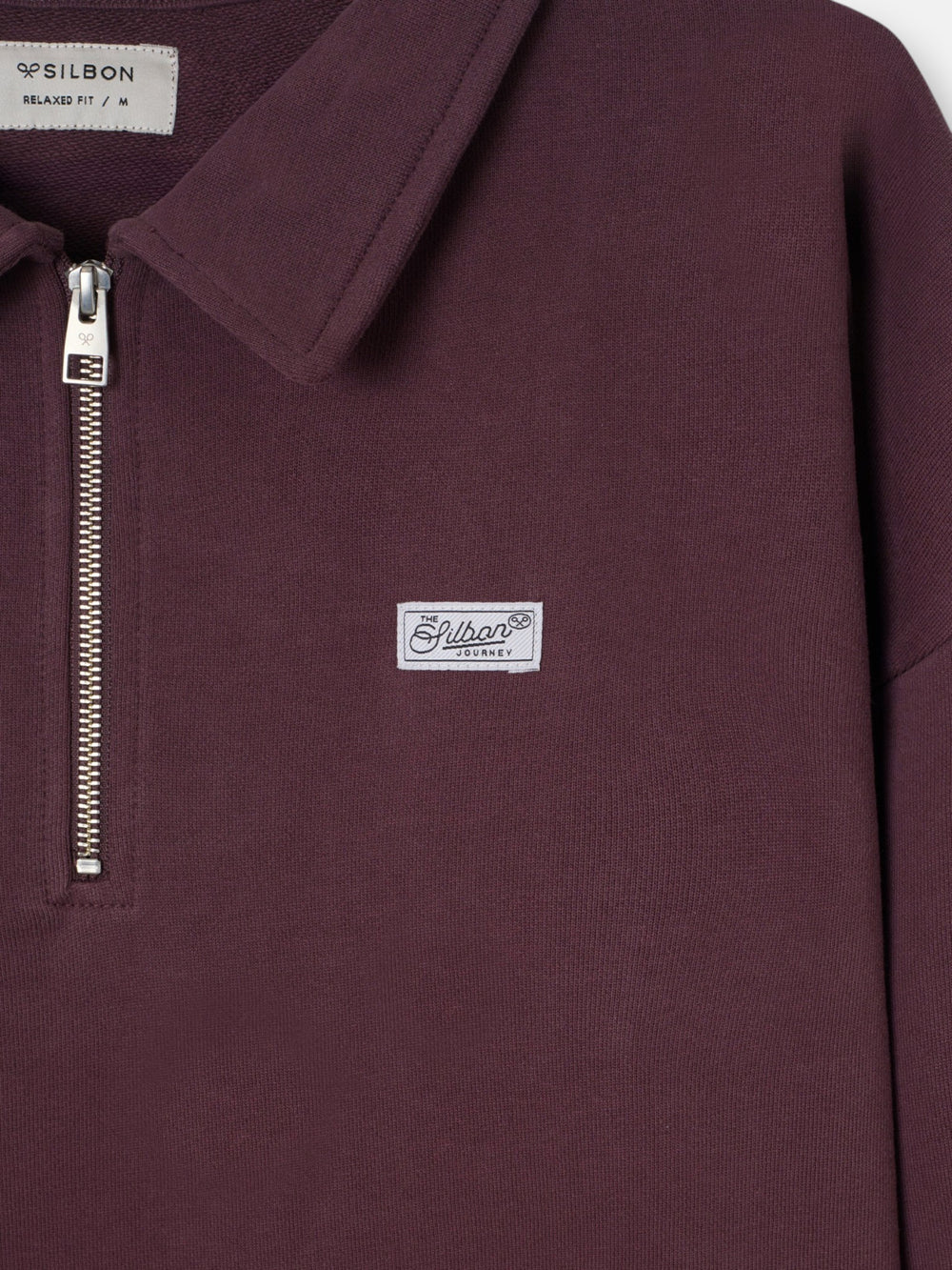 Sudadera relaxed fit media cremallera etiqueta burdeos