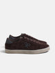 Worn brown suede sneaker
