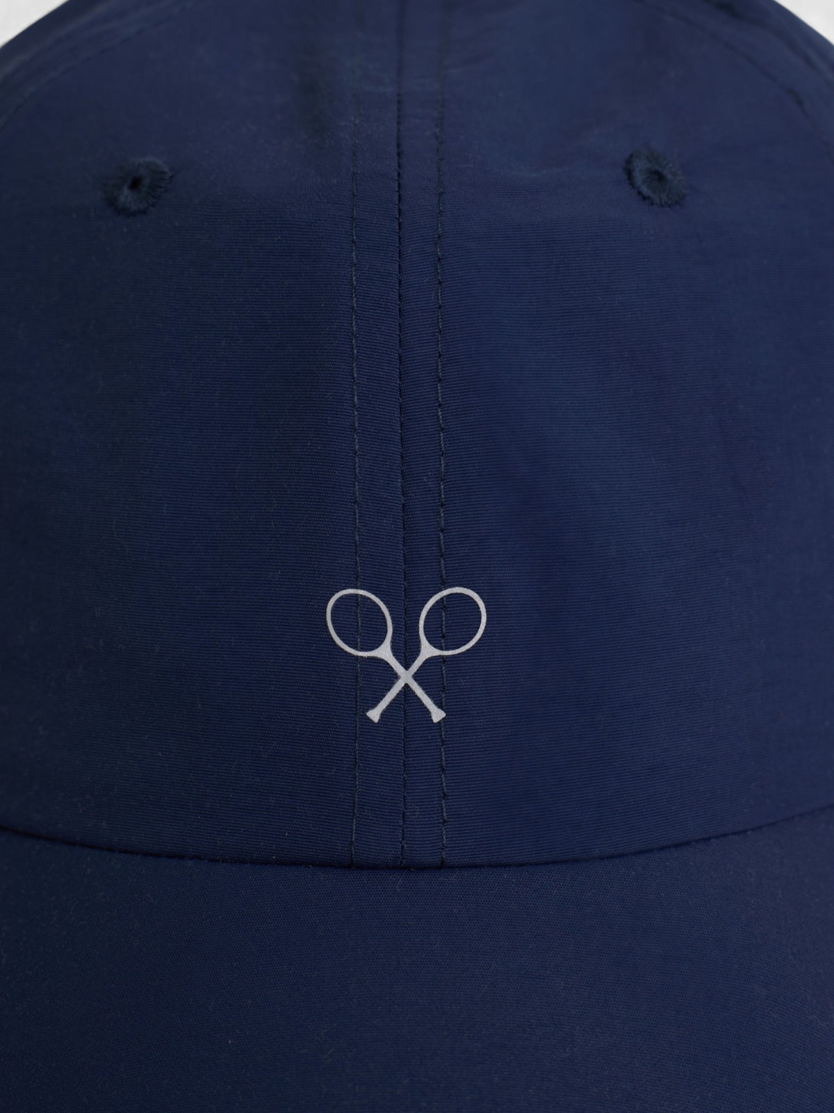 Gorra tejido técnico raquetas azul marino