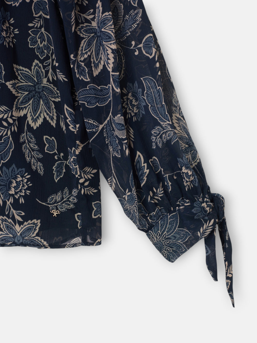 Blue floral print blouse with tied sleeves