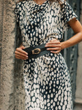 Robe midi drapée à pois blanc et noir