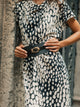 Robe midi drapée à pois blanc et noir